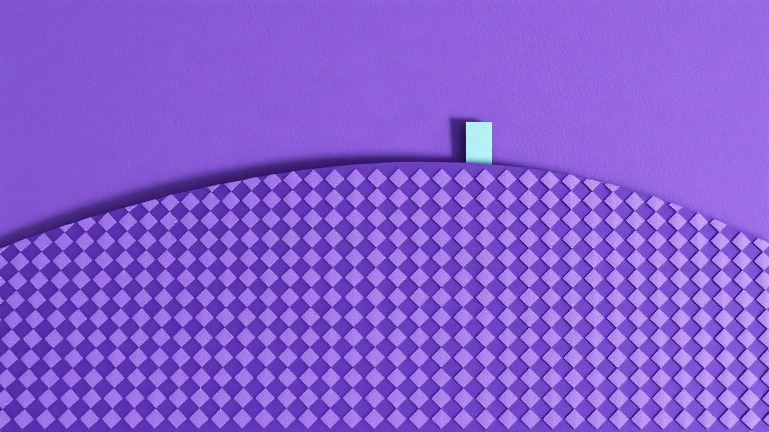 A broad rise paved with dense rows of small violet diamonds, one small mint block standing alone at its crest